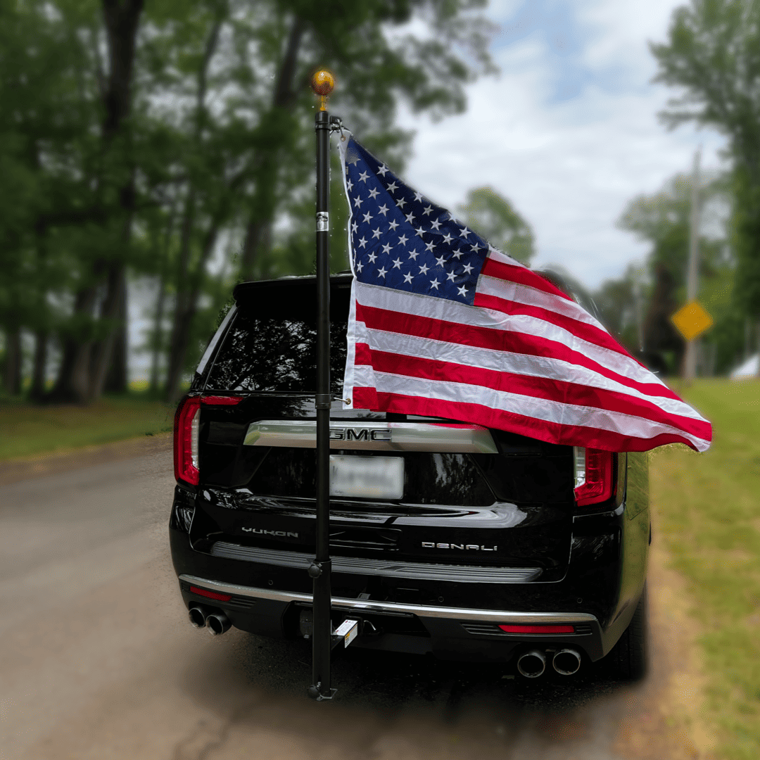 Black powder-coated Phoenix Outrigger hitch mount for flagpole from Atlantic Flag & Pole Inc.