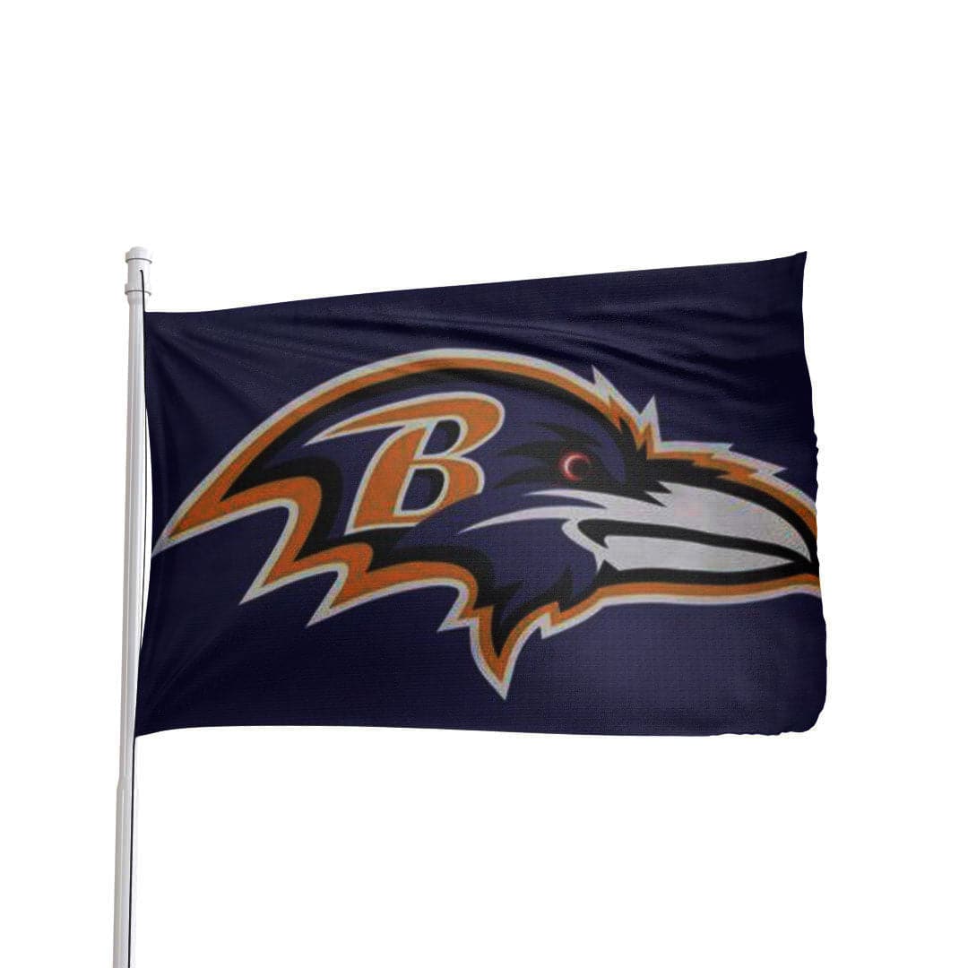 Sports flags for game day decor displayed on a residential flagpole