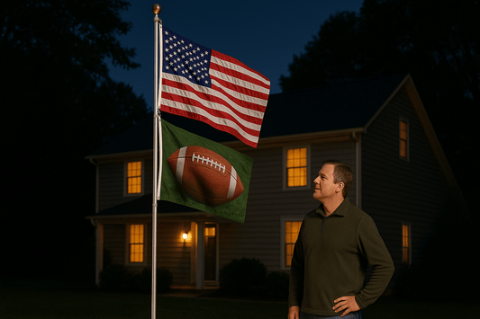 Man standing outside his home at night looking at his telescoping flagpole, american flag, and football flag