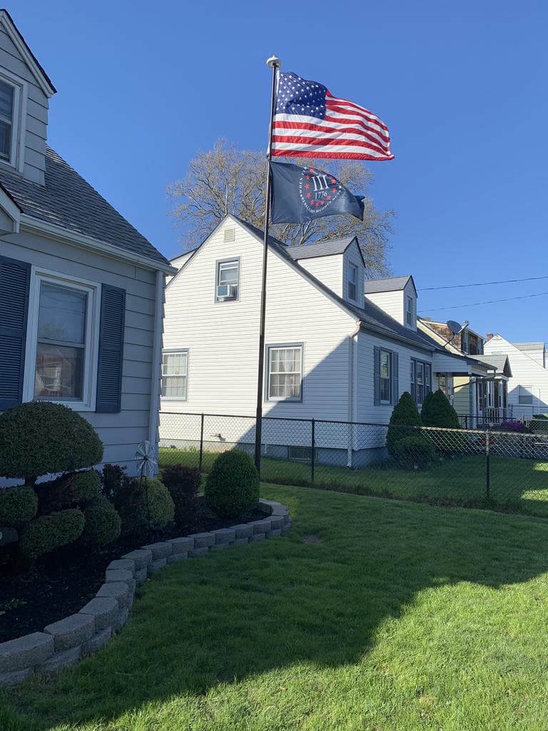 Atlantic Flagpole Telepatriot 400 Series white solar flagpole lighting system with bright LED lights.