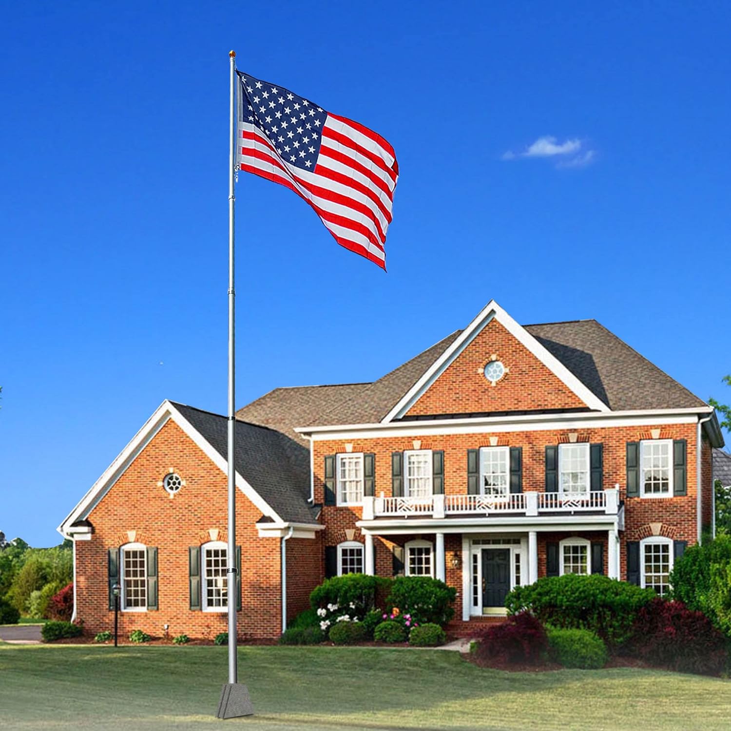 Heavy duty silver American flag display pole from Atlantic Flagpole, featuring a waving American flag outside a brick house.