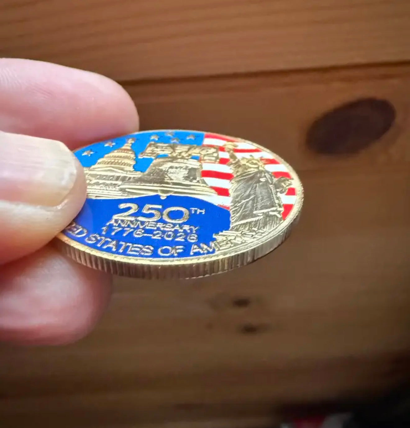 America 250 Challenge Coin front design shown at an angle, raised detail and thickness