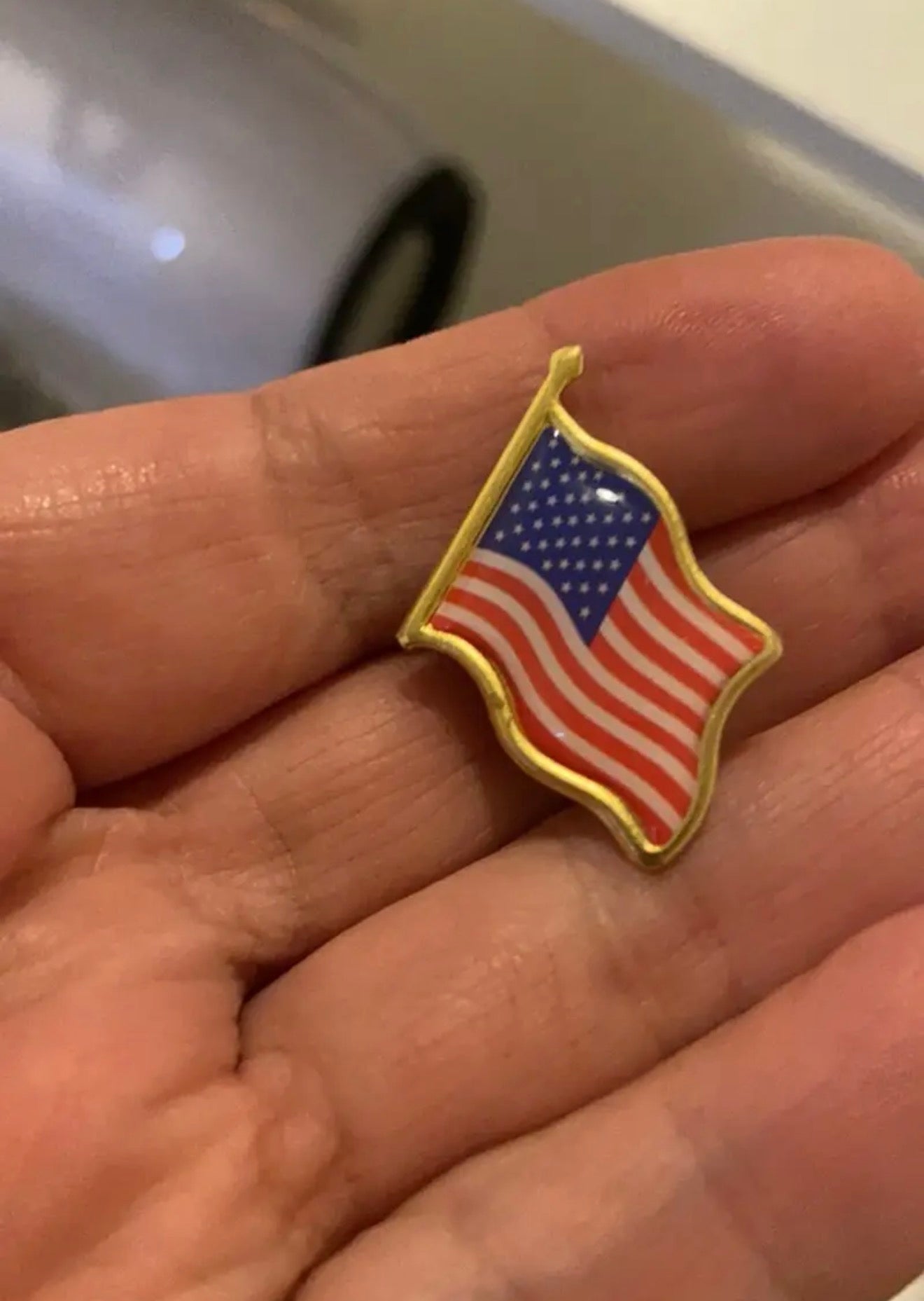 American Flag Lapel Pin front - waving USA flag enamel with gold border