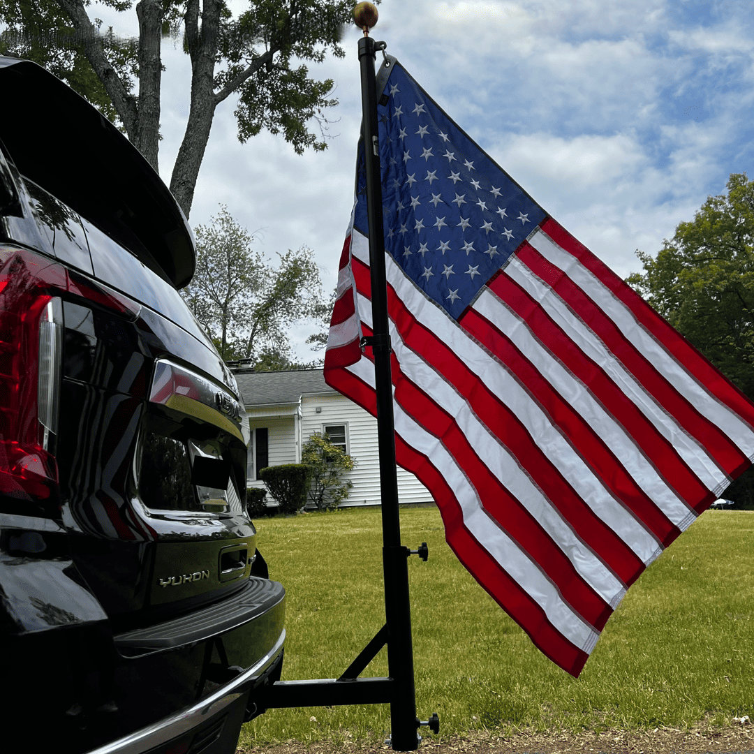 Black powdercoated Phoenix Outrigger hitch mount for flagpole by Atlantic Flag & Pole Inc.