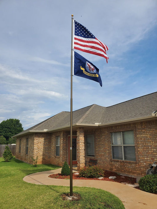 Gold telescoping flagpole kit with USA and state flags, showcasing 15-foot height, ideal for residential display.