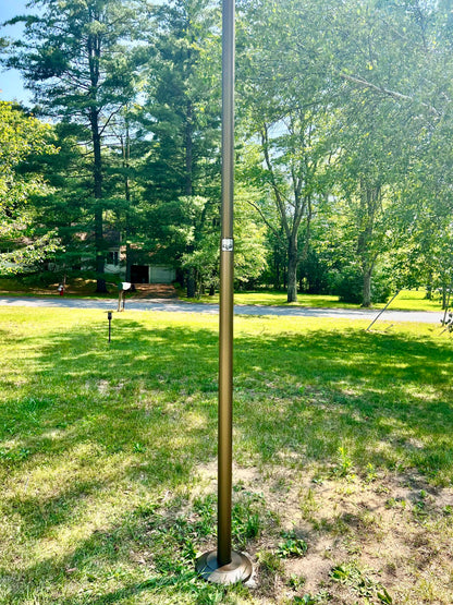 Golden anodized flagpole by Atlantic Flagpole, 20 feet, sleek and sturdy design, perfect for outdoor display.