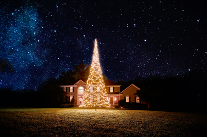 Warm white LED Christmas tree lights on 20' flagpole, displayed outside a house, by Atlantic Flagpole.